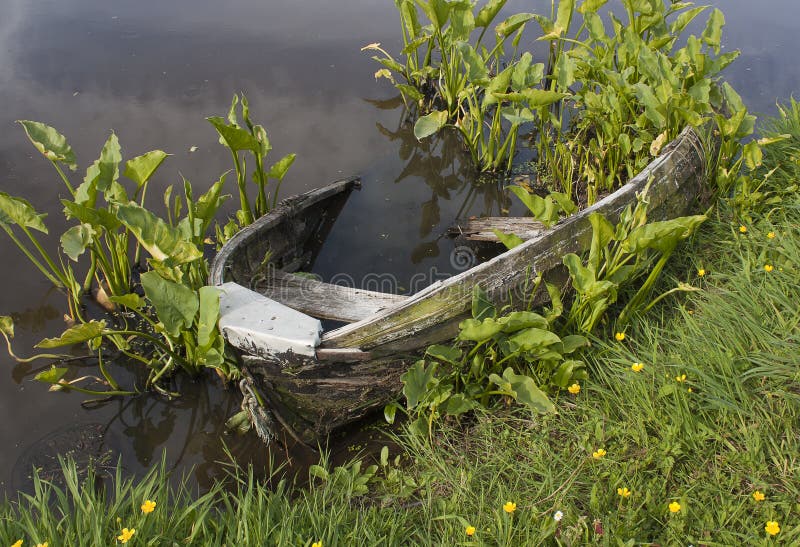 Wrecked Row Boat In Pond Stock Photos - Image: 34910003
