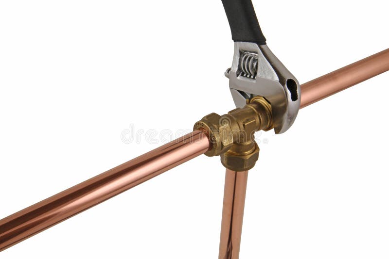 Wremch ` s водопроводчика регулируемое затягивая вверх медный pipework стоковая фотография Wremch ` s водопроводчика регулируемое затягивая вверх медный pipework стоковая фотография