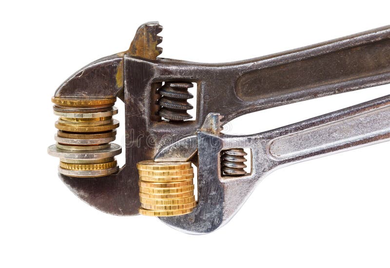 Wrench and coins stock photos