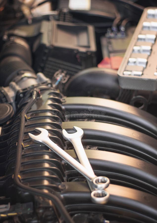 Wrenches Lie on the Engine of the Car in the Engine Compartment Stock