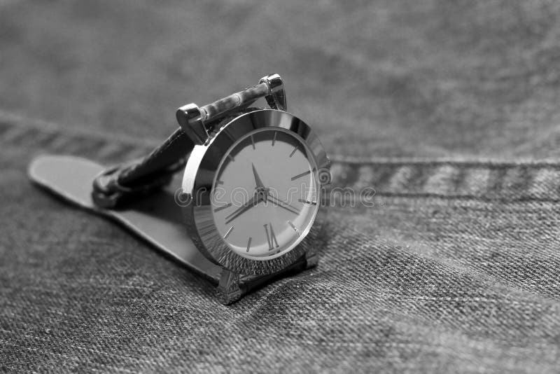 Wrist steel watch on jeans stock image. Image of luxury 82808675