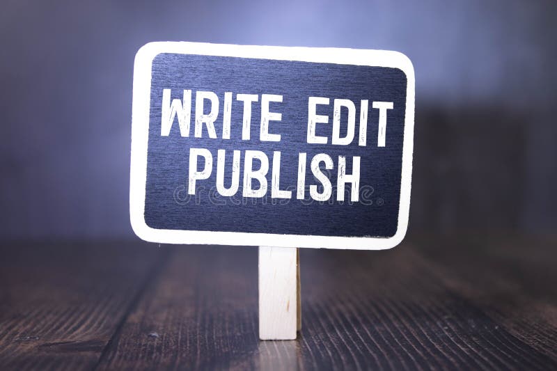 WRITE EDIT PUBLISH. notebook on a wooden table royalty free stock image