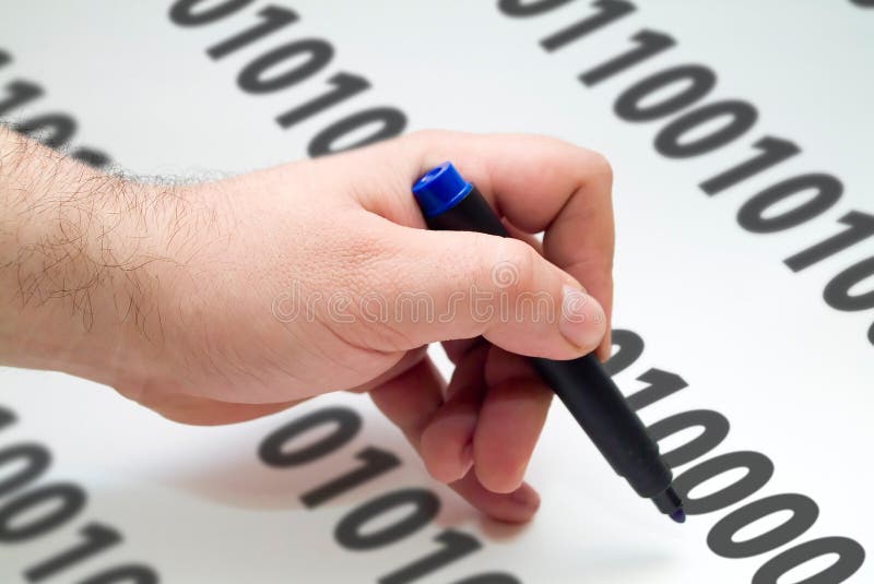 Hand with blue pen writing binary code. Hand with blue pen writing binary code