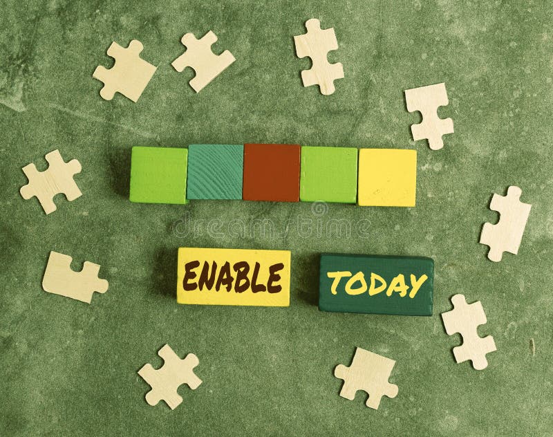 Writing displaying text Enable. Word Written on give someone or something the authority or means to do something Stack stock photography