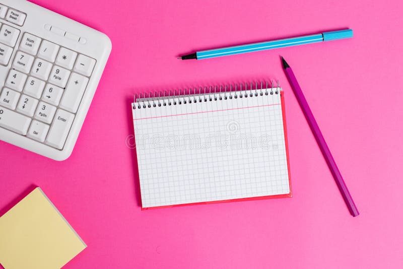 Writing Equipments and Computer Stuffs Plus Mathematic Paper Placed on