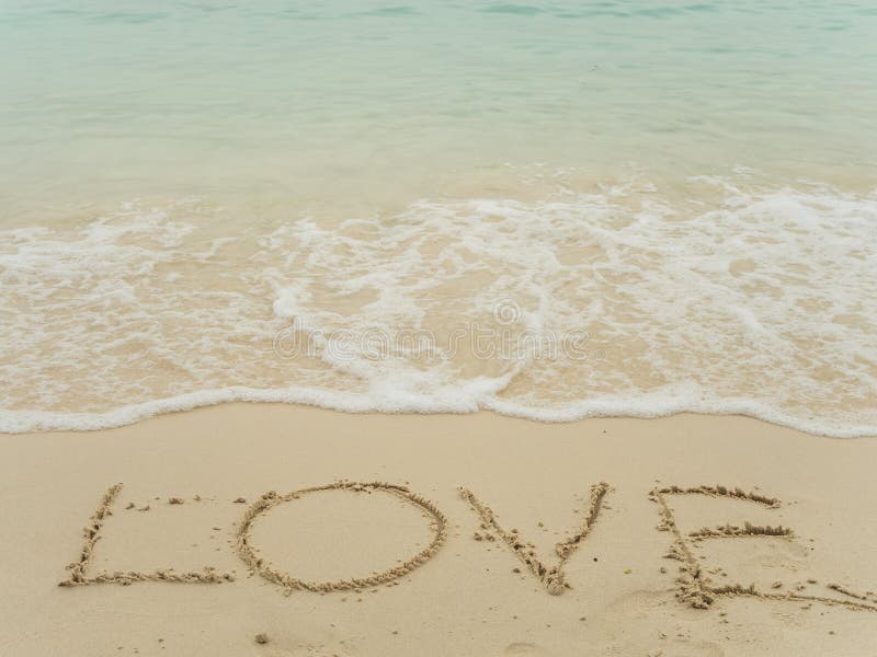 Writing love on beach royalty free stock photography Writing love on beach royalty free stock photography