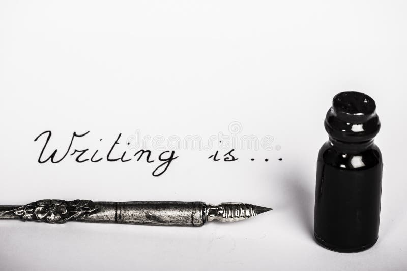 Writing is... with old pen and ink bottle