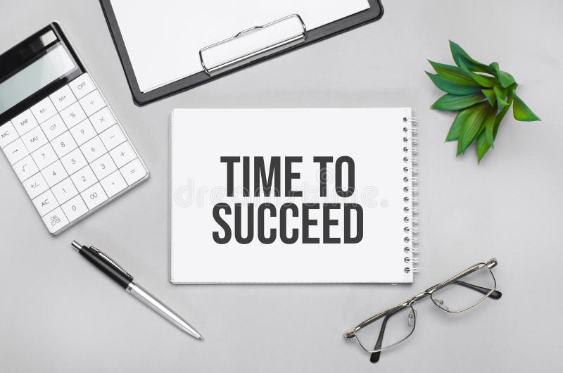 Writing text showing Time to succeed. Calculator,pen,plan,glasses and black folder on grey background stock image