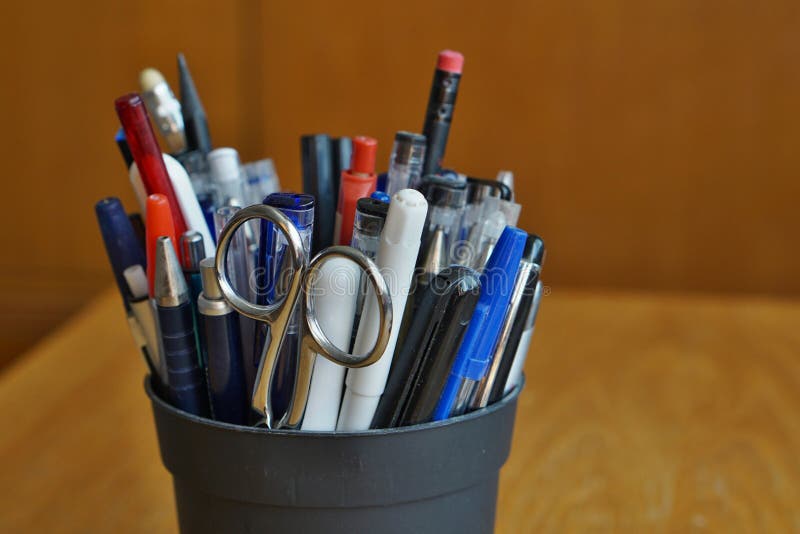 Writing utensils in the business environment with ball pens, highlighters and pens