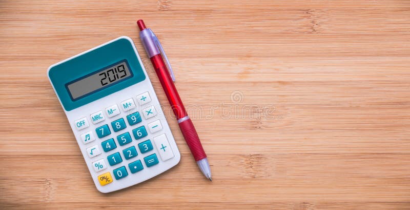 2019 written on a calculator and a pen on wood background royalty free stock photos 2019 written on a calculator and a pen on wood background royalty free stock photos
