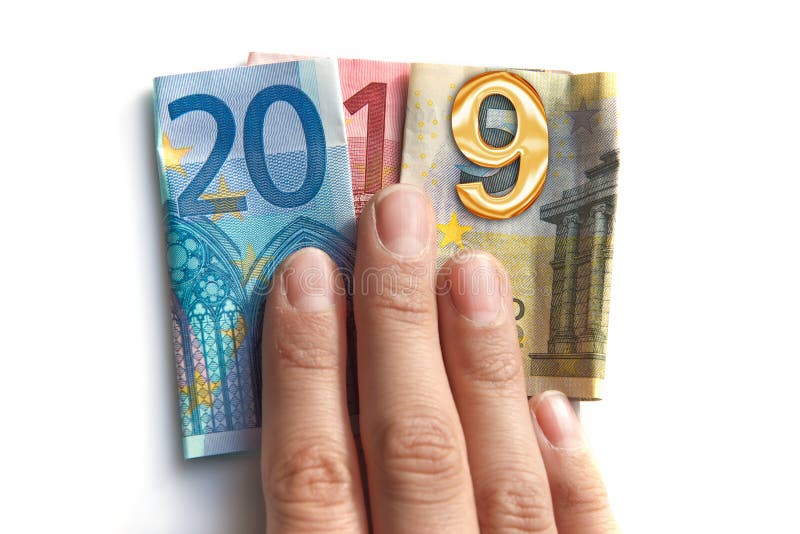2019 written with euros bank notes in a hand isolated on white stock image 2019 written with euros bank notes in a hand isolated on white stock image