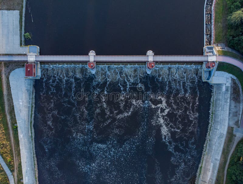 Aerial top down look to bridge with water dam