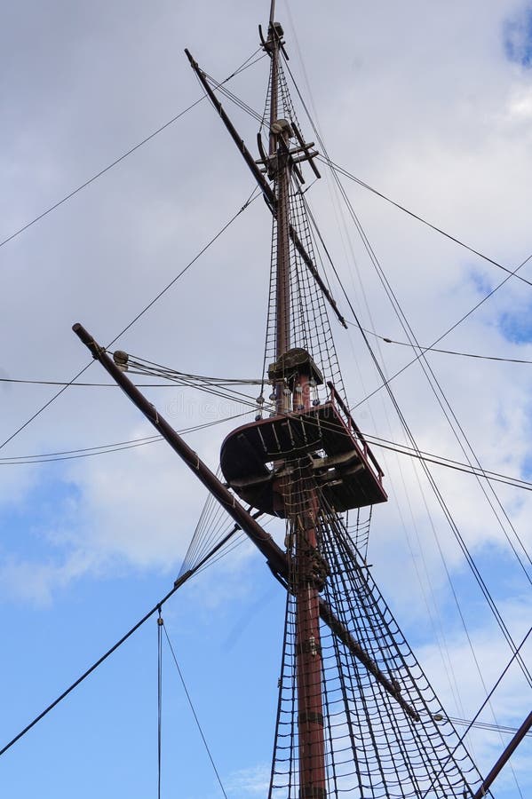 A crows nest of the mast of the Amsterdam, a frigate anchored at the Maritime Museum in the harbor of Amsterdam. A crows nest of the mast of the Amsterdam, a frigate anchored at the Maritime Museum in the harbor of Amsterdam