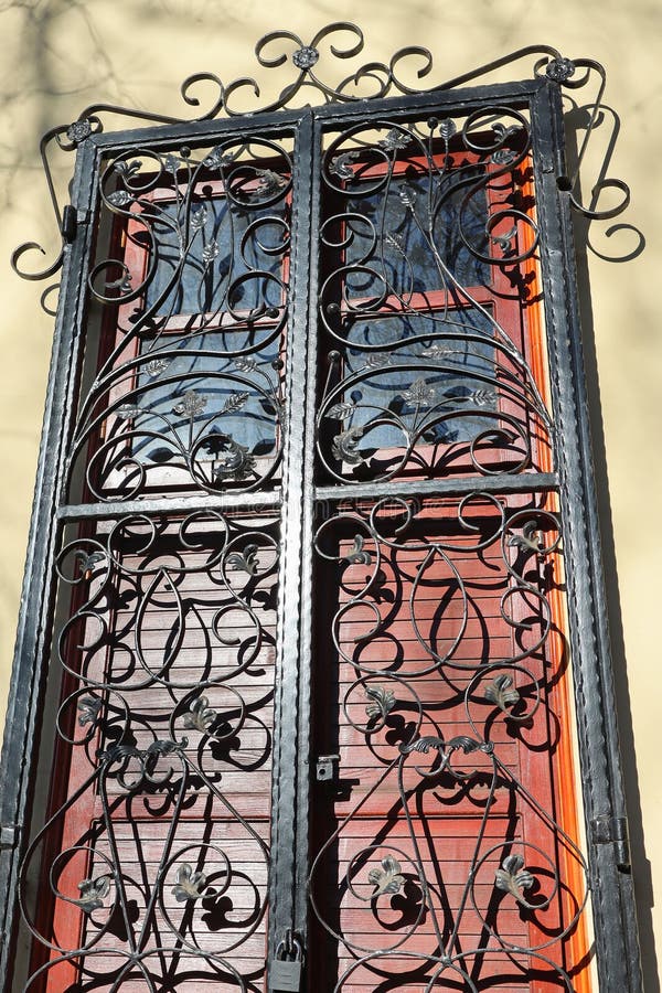 Wrought iron protector on a window of a house royalty free stock images