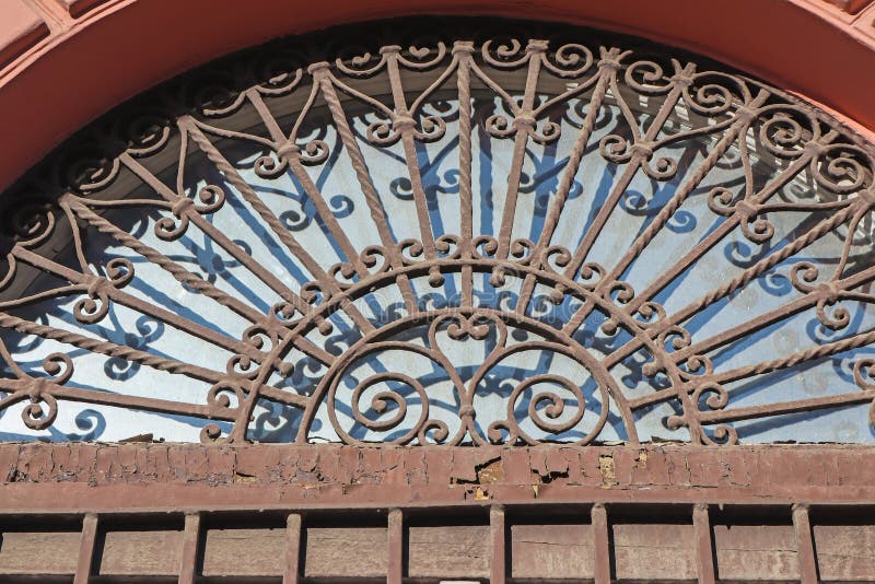 Wrought iron protector on a window of a house stock images