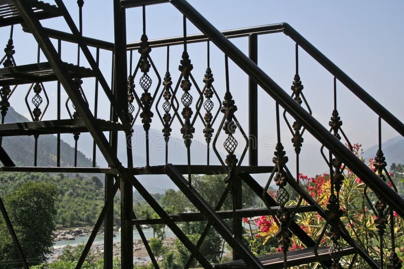 Wrought iron steps in mountain home with a view