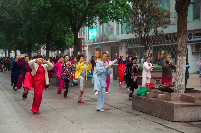 WUHAN,CHINA - April 22, 2019 - People performing exercise in the morning at the city. Qigong class stock images, royalty-free photos and pictures