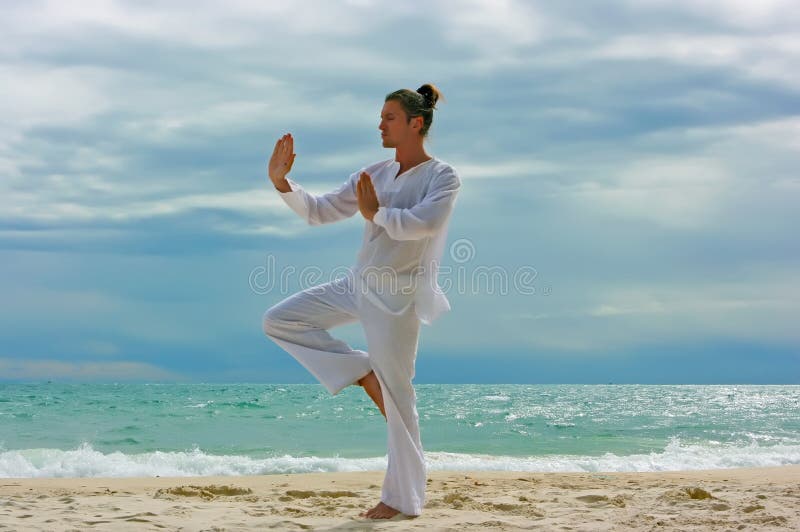 Wushu man on the beach