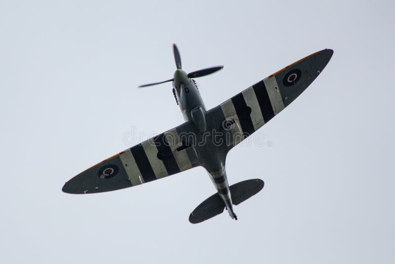 A WW2 British RAF Spitfire, fighter airplane, flying over Biggin Hill, Kent