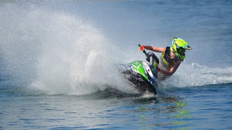 Jet Ski Competitor Cornering at Speed Creating at Lot of Spray Jet Ski Competitor Cornering at Speed Creating at Lot of Spray