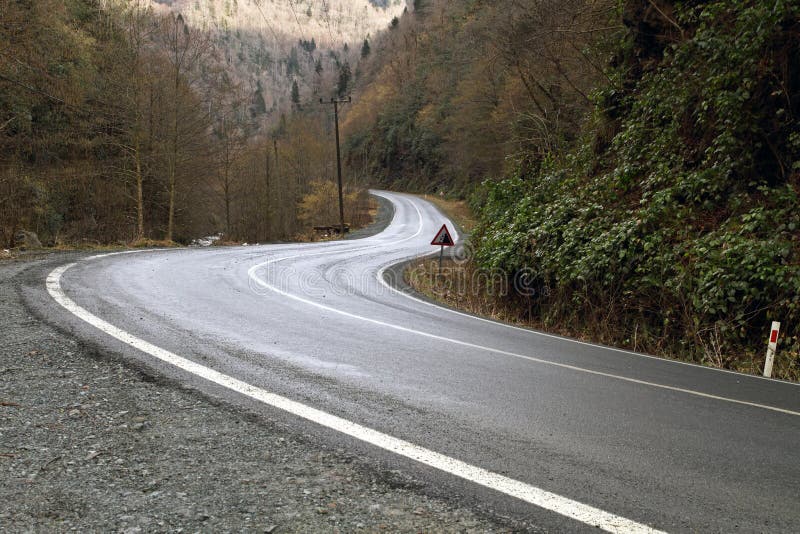 Curved asphalt mountain road image. Curved asphalt mountain road image