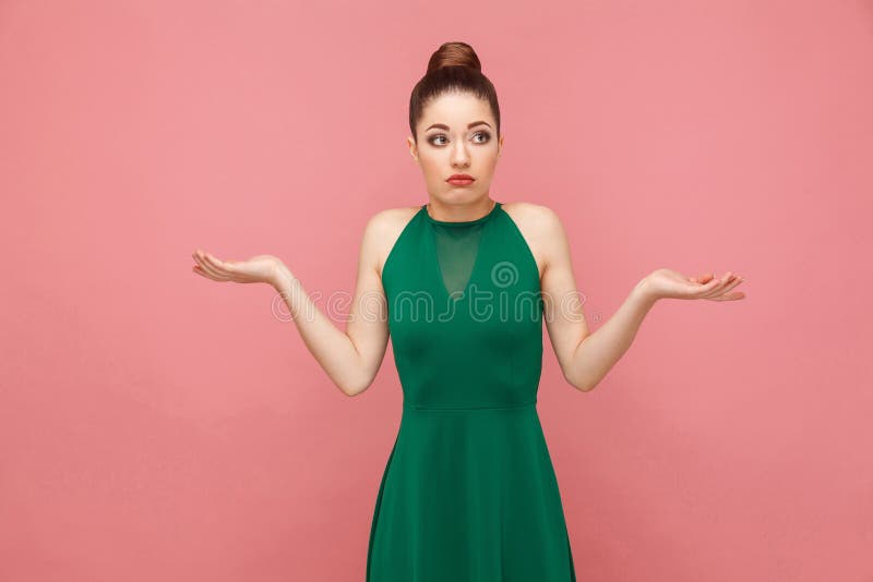 I don`t know. Portrait of cute puzzled woman. Expression emotion and feelings concept. Studio shot, on pink background. I don`t know. Portrait of cute puzzled woman. Expression emotion and feelings concept. Studio shot, on pink background