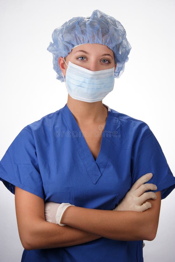 A stock image of a pretty scrub nurse crossing her arms. A stock image of a pretty scrub nurse crossing her arms.