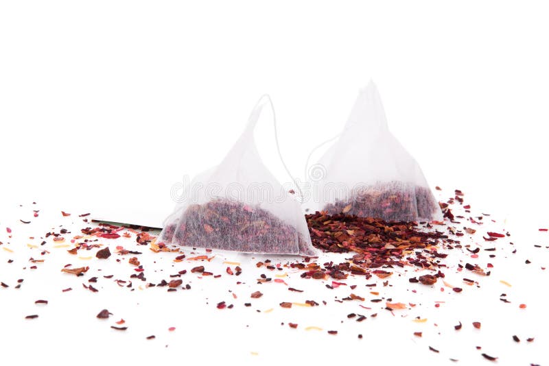 Fruit tea in bag and dried fruit tea crop on white background. Healthy tea drinking concept. Fruit tea in bag and dried fruit tea crop on white background. Healthy tea drinking concept.