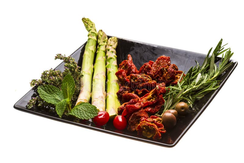 Wysuszony pomidor z asparagusem obrazy royalty free