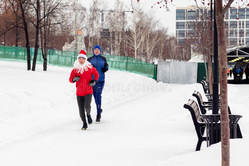 Race on January 1 in New Year&#x27;s costumes running club Novosibirsk 01.01.2024 Running people in winter photo. Race on January 1 in New Year&#x27;s costumes running club Novosibirsk 01.01.2024 Running people in winter photo