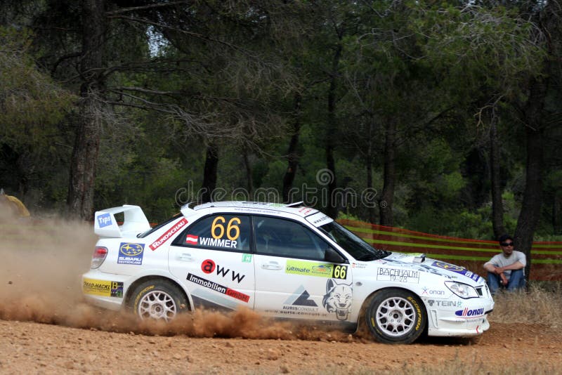 A trail of dust left behind by the race car at the WRC 55th Acropolis Rally 2008 in Greece. A trail of dust left behind by the race car at the WRC 55th Acropolis Rally 2008 in Greece.