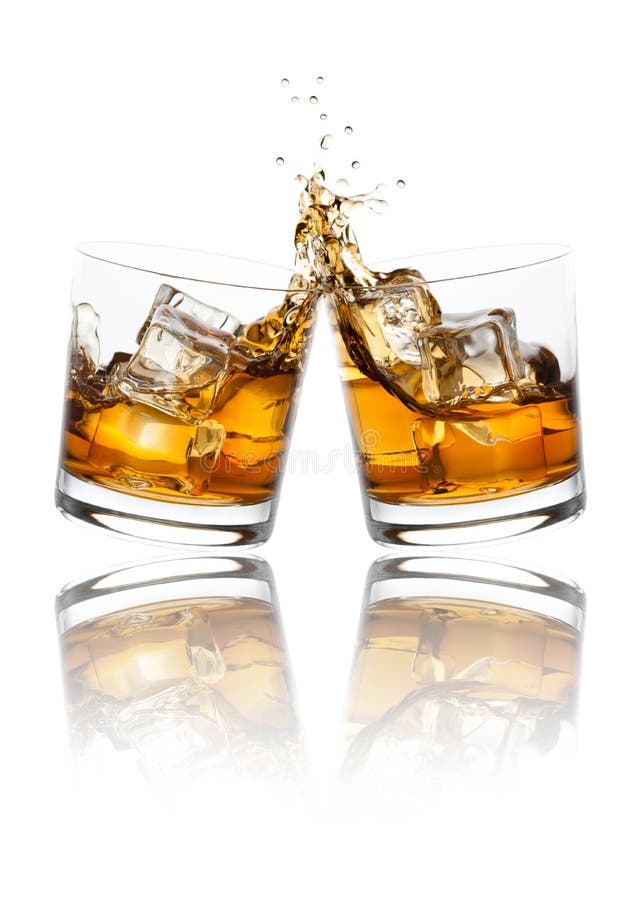 Two whiskey glasses clinking together, isolated on white. Two whiskey glasses clinking together, isolated on white.