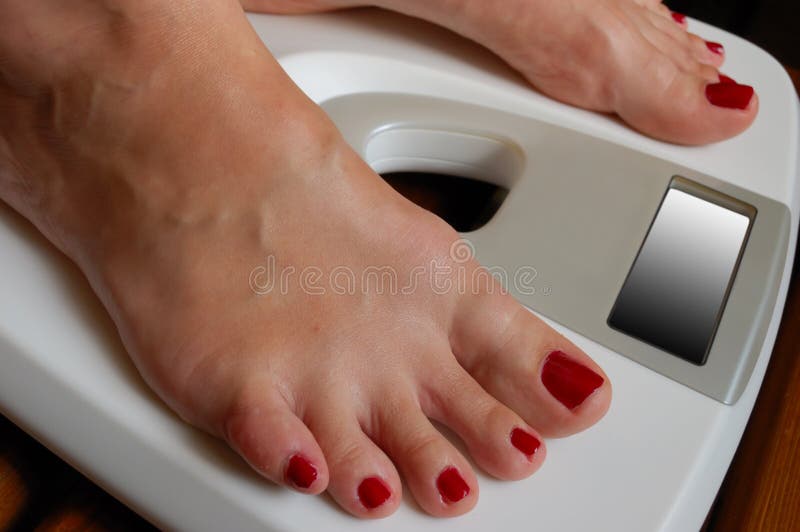 Weigher and white female feet. Weigher and white female feet