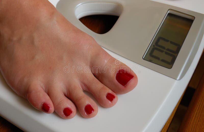 White weigher and female foot. White weigher and female foot