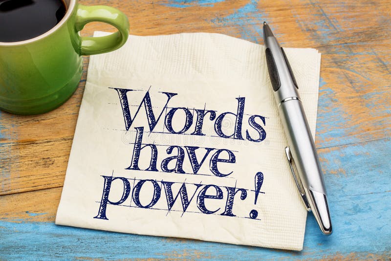 Words have power - handwriting on a napkin with cup of coffee against grunge wood. Words have power - handwriting on a napkin with cup of coffee against grunge wood