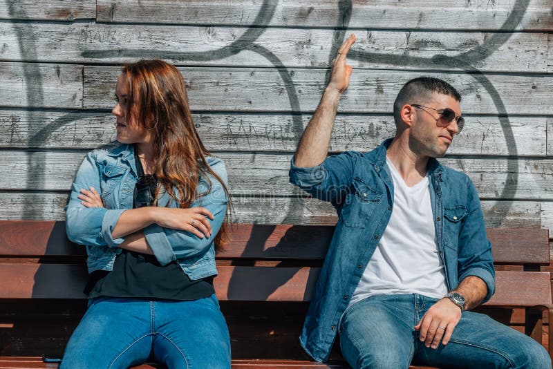 Angry couple arguing in the street. Angry couple arguing in the street