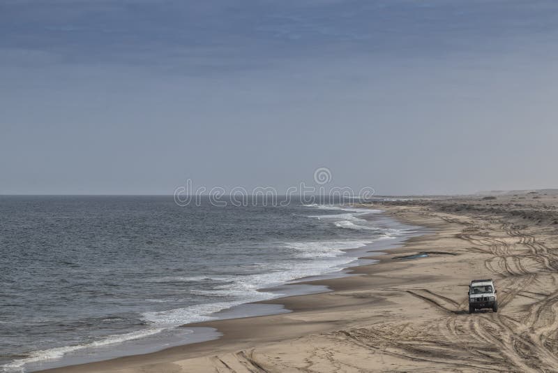 4x4 Jeep on the wild beach of the Namibe Desert. Angola. Africa