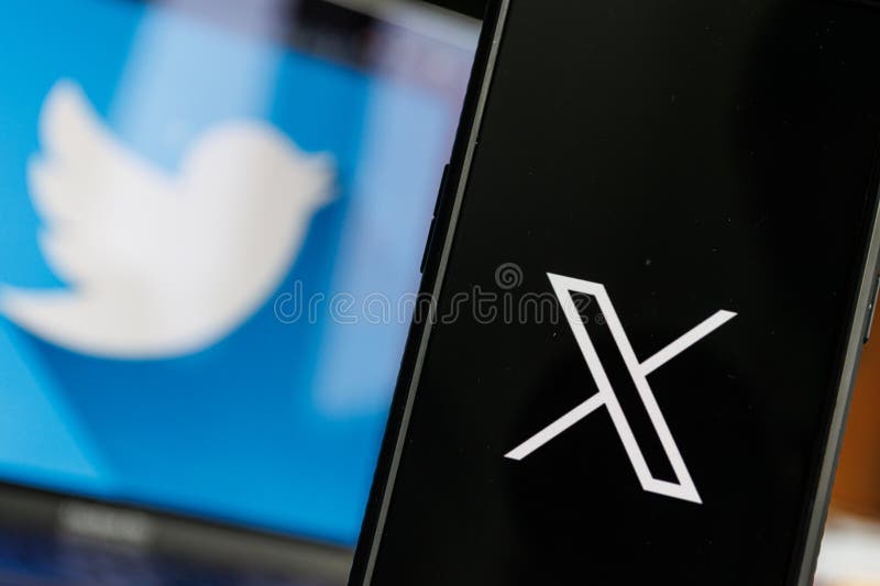 X logo and the twitter logo on the screen.