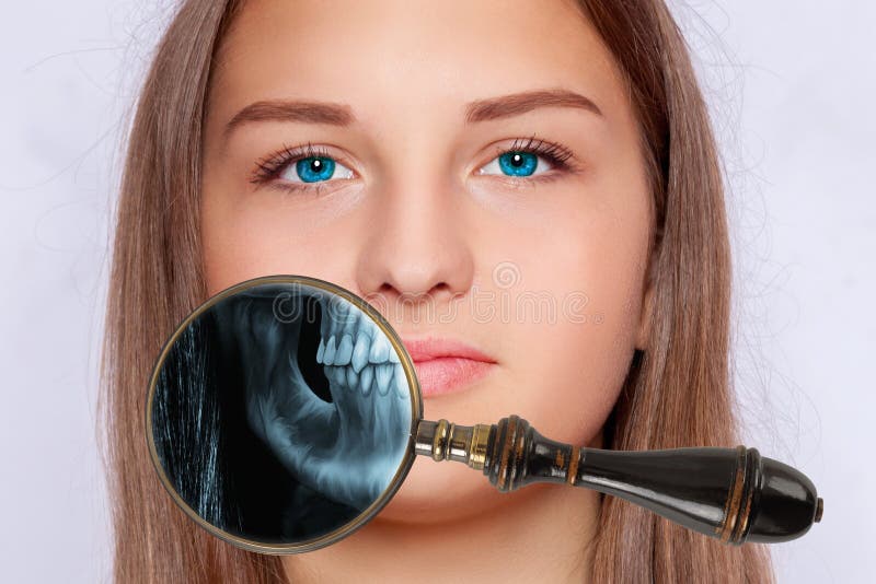 Xray with a Magnifying Glass from the Visual Field of a Person`s Jaw