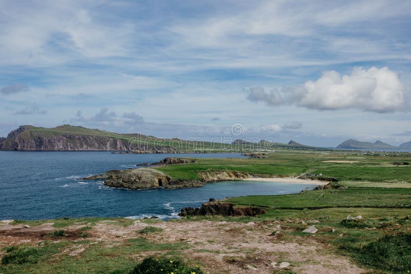 Wide Irish &x22;Three Sisters&x22; hills in Dingle Peninsula with blue sky background