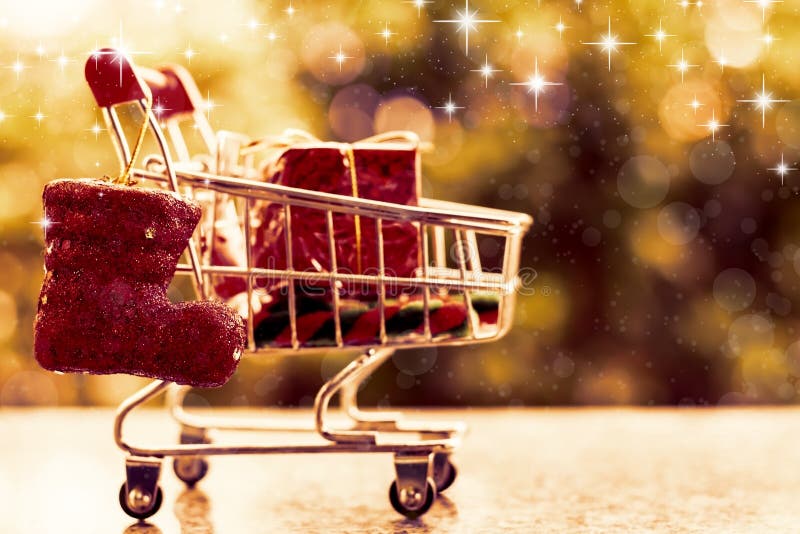 Xmas decorative items in mini shopping cart or trolley royalty free stock photos Xmas decorative items in mini shopping cart or trolley royalty free stock photos