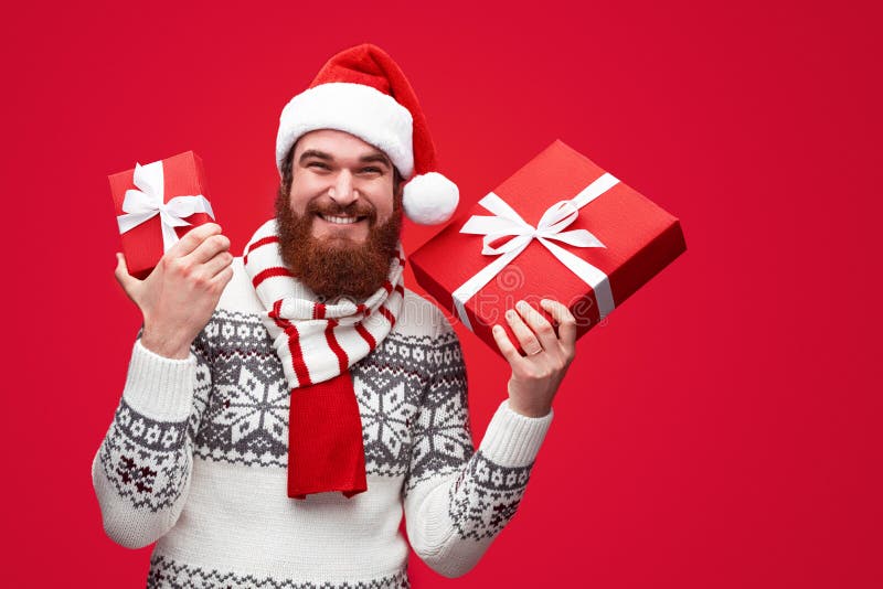 Xmas present from modern looking hipster santa royalty free stock photo Xmas present from modern looking hipster santa royalty free stock photo