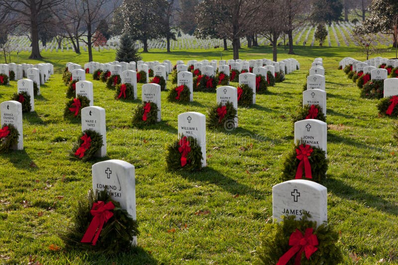 ARLINGTON, VA - DECEMBER 18: Christmas wreaths on gravestones in Arlington National Cemetery on December 18, 2011. The wreathes have been donated each year since 1992. ARLINGTON, VA - DECEMBER 18: Christmas wreaths on gravestones in Arlington National Cemetery on December 18, 2011. The wreathes have been donated each year since 1992.