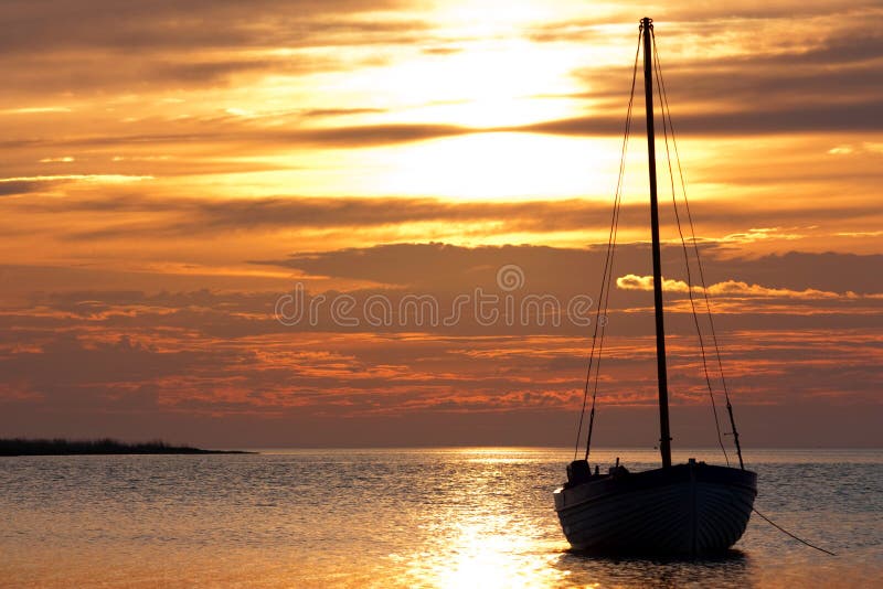 Yacht on an anchor on a background of the coming s