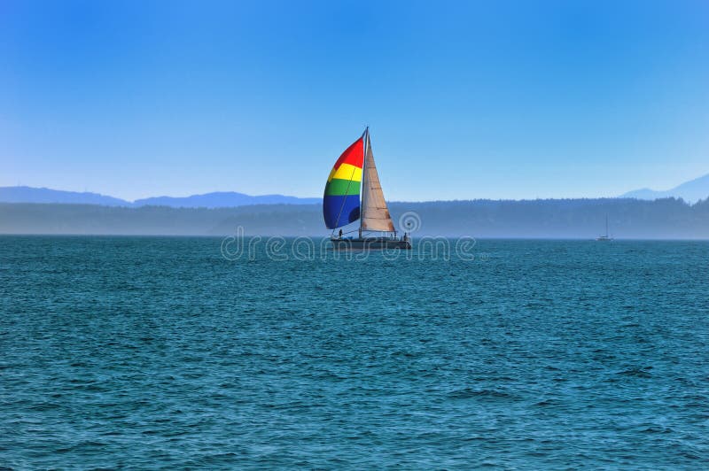 A yacht with a bright sail.