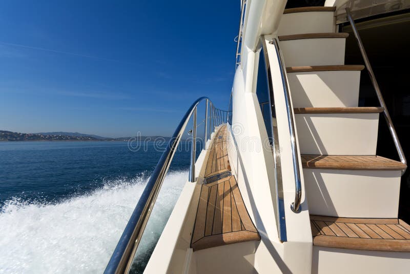 On-board shot of a luxury motor yacht cruising the sea. On-board shot of a luxury motor yacht cruising the sea.