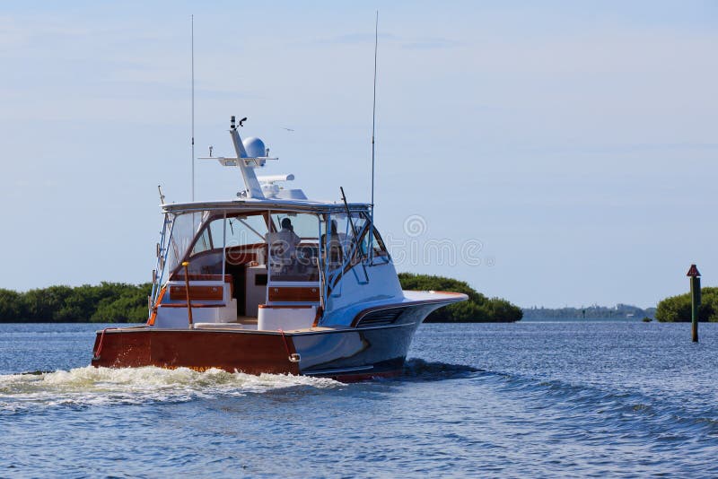 Yacht - Fishing Boat on the water heading out of harbor. Yacht - Fishing Boat on the water heading out of harbor