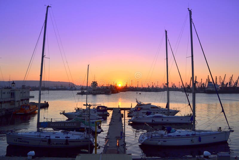Yacht pier to setting sun