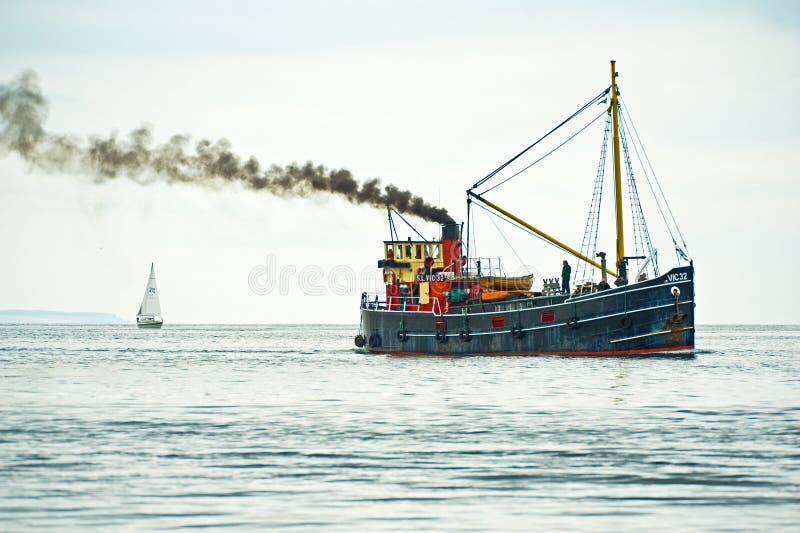Yacht and Puffer sailing on Moray Firth.