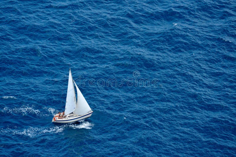 Yacht sailing in blue sea